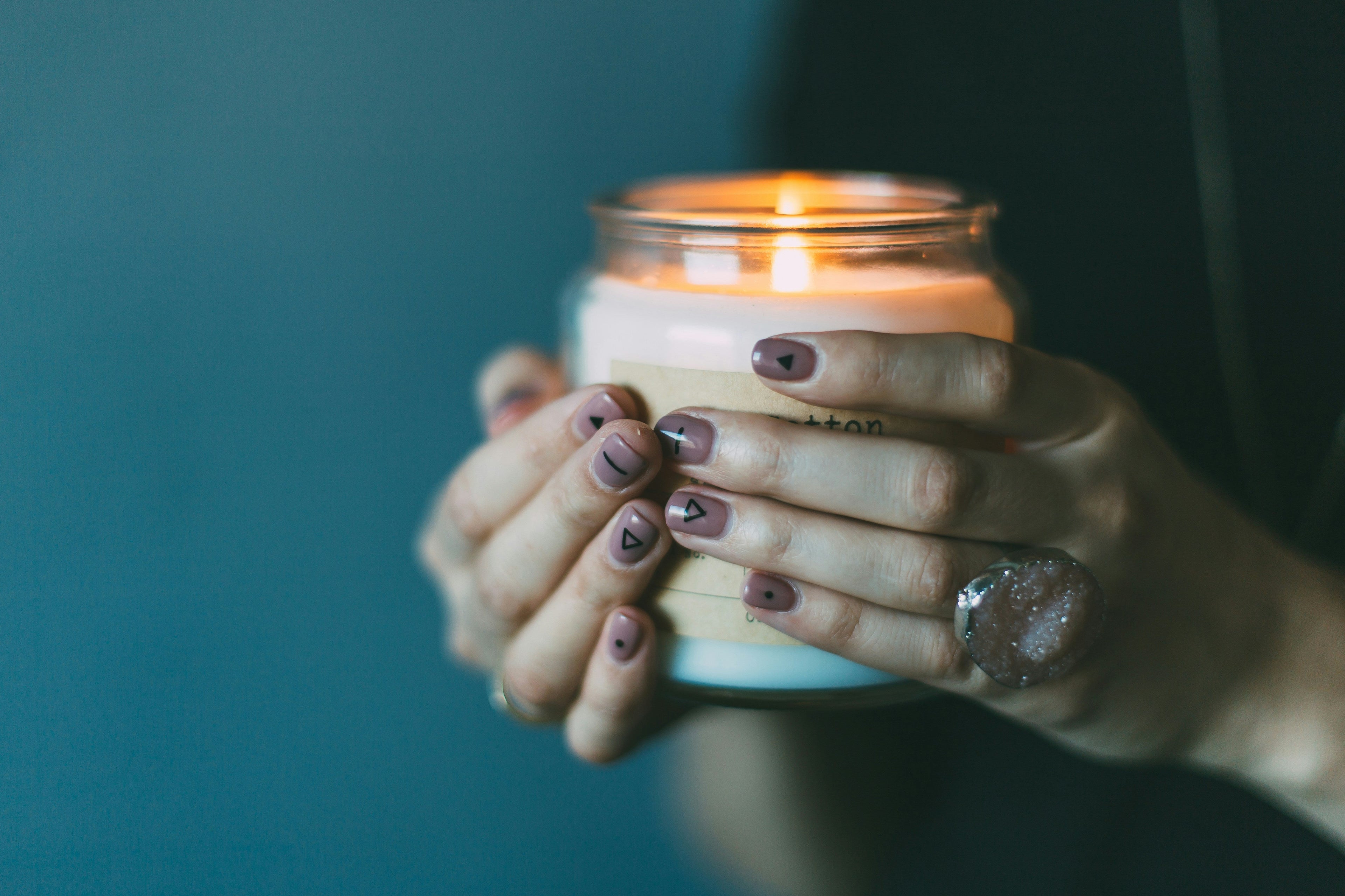 Candle warmer lamp with a sleek design, gently melting a scented candle to release fragrance without an open flame.